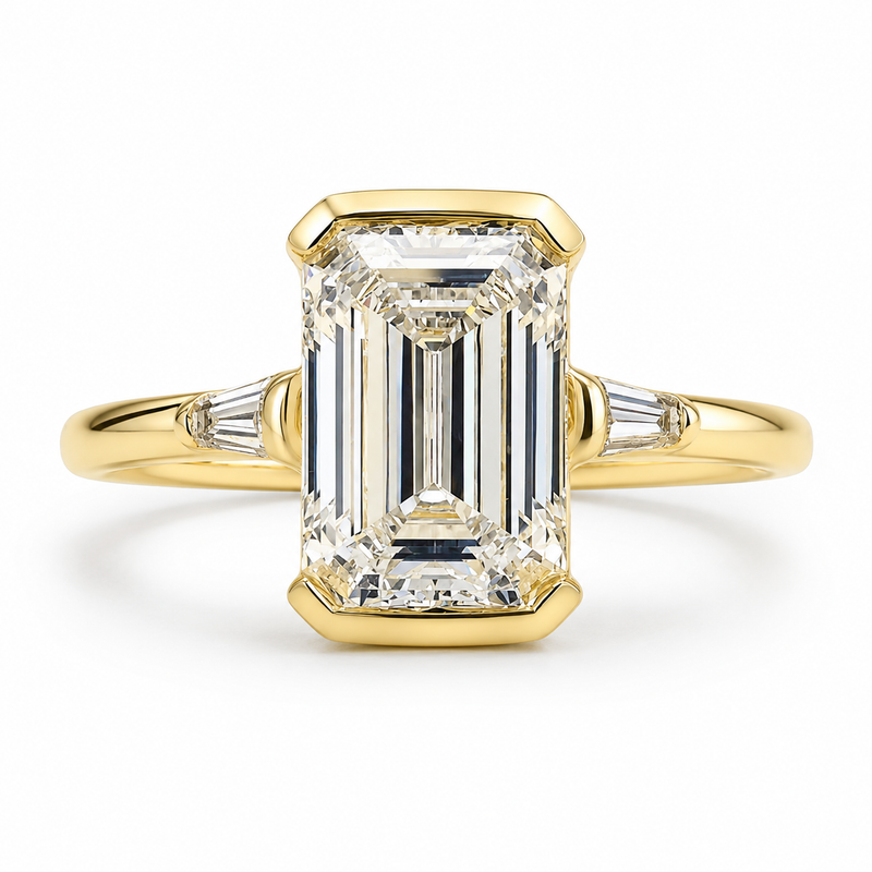 The Trieste — Emerald Bezel Three Stone Ring
